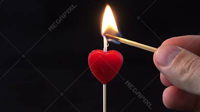 Lighting a red candle 4K