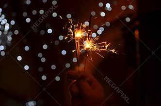 New years eve celebration with hand held sparkler fireworks