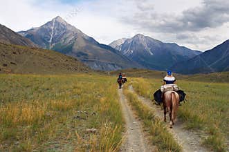 Women on horseback.