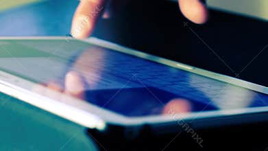 Man using finger for touching keyboard tablet computer pc touchscreen, blue color style