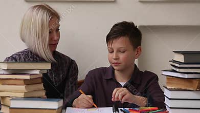Student doing homework with the help of a tutor.