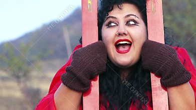 Portrait of Crazy Weird Woman With Skis At Nature