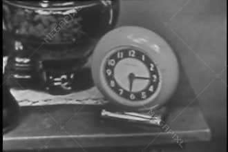 Sleeping man answering telephone on night stand