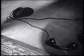 Telephone receiver lying on floor
