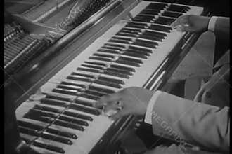 Medium shot of jazz musician playing piano