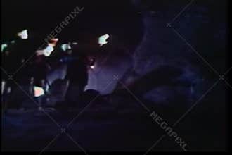 Barbarians running with burning torches in thunderstorm