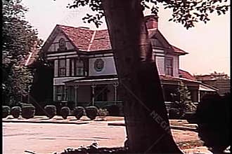 Zoom in to house on suburban street