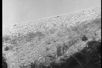 Speeding car veering off road and falling off cliff, 1930s