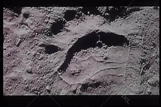 Close-up of large footprints in mud