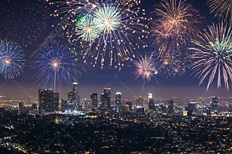 Downtown Los angeles cityscape with fireworks celebrating New Year's Eve.