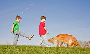 Boys Walking the dog