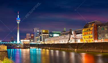 Colorful night scene of Rhein river at night in Dusseldorf.