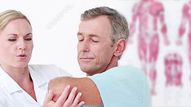 Doctor stretching her patient arm