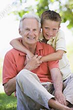 Grandfather and grandson smiling