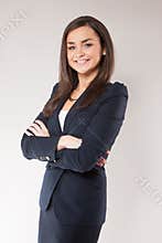 Young happy business woman with cross hands.