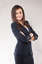 Young happy business woman with cross hands.