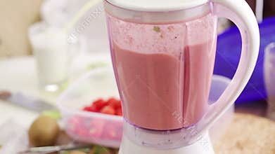Making strawberry smoothie - food processor working