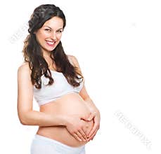 Happy pregnant woman touching her belly