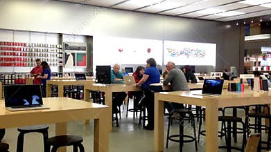Motion of customers and shop assistants at the Apple store.