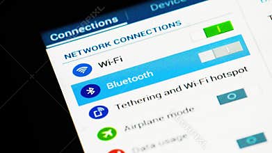 Man using finger for setting wifi, bluetooth and tethering on tablet computer pc ipad touch screen