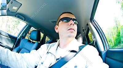 Man driving with sunglasses