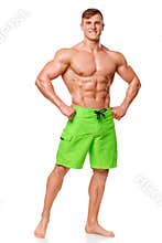 athletic man showing muscular body, isolated over white background. Strong male nacked torso abs