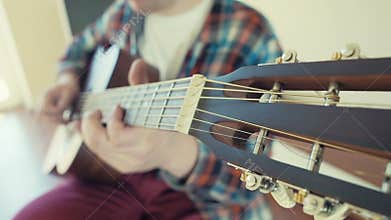 Man playing acoustic guitar background slow motion
