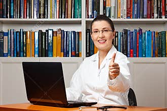 Female doctor smile thumbs up