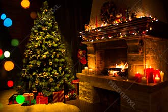 Fireplace and decorated Christmas tree and candles