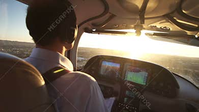 Private Airplane Pilot Flying at Sunset View