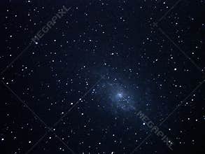 Night sky stars and spiral galaxy M33 over telescope