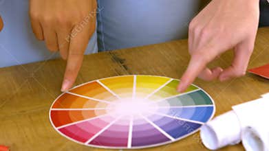 Creative team choosing colours from a colour wheel