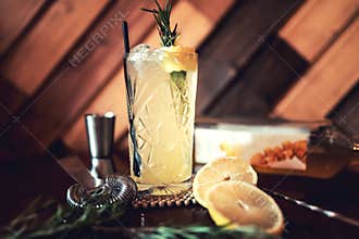Gin and tonic alcoholic cocktail with lime and ice, served as refreshment drink in local pub. Party starter, nightlife