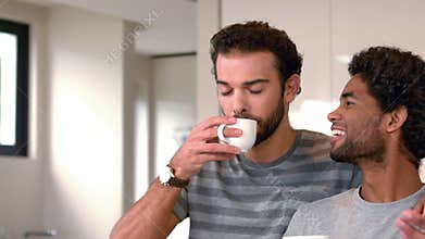 Gay couple drinking cup of coffee