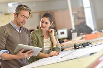 Architects working in tablet