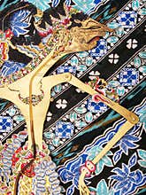 Wayang Kulit puppet on batik