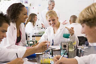 School children and their teacher in science class