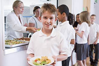 Schoolboy in a school cafeteria