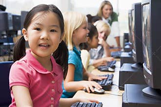Children learning how to use computers.