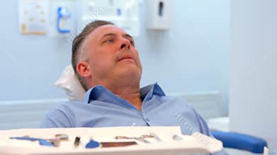 Patient sitting in a dentist chair