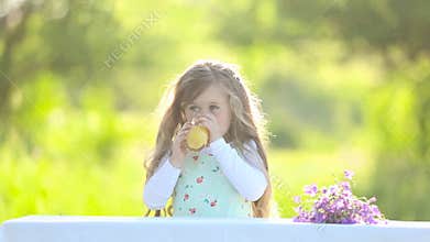 Girl drinking orange juice