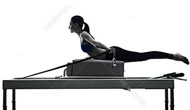 Woman pilates reformer exercises fitness isolated