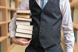 Student is borrowing many books in library