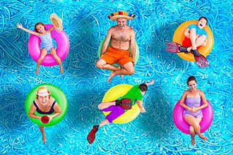 Family fun in the swimming pool in summer