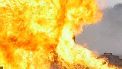 Stunt girl in a fiery explosion. Slow motion.