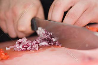 Cutting onions with chefs knife