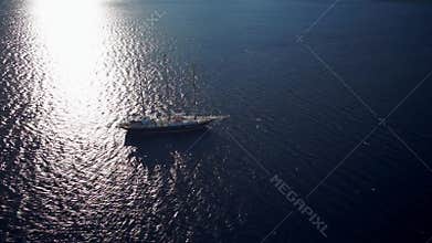 Sailing ship in calm weather sailing on the ocean