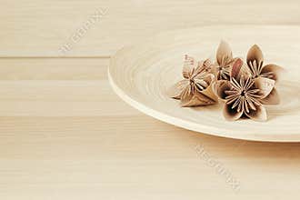 Home decor. Craft flowers. Wood background.