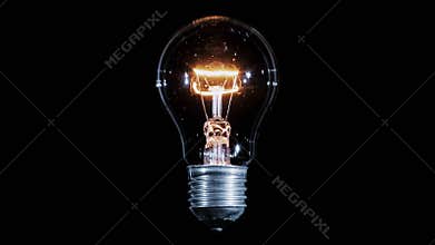 Tungsten light bulb lamp blinking over black background, loop