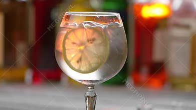 Glass with drink and ice.